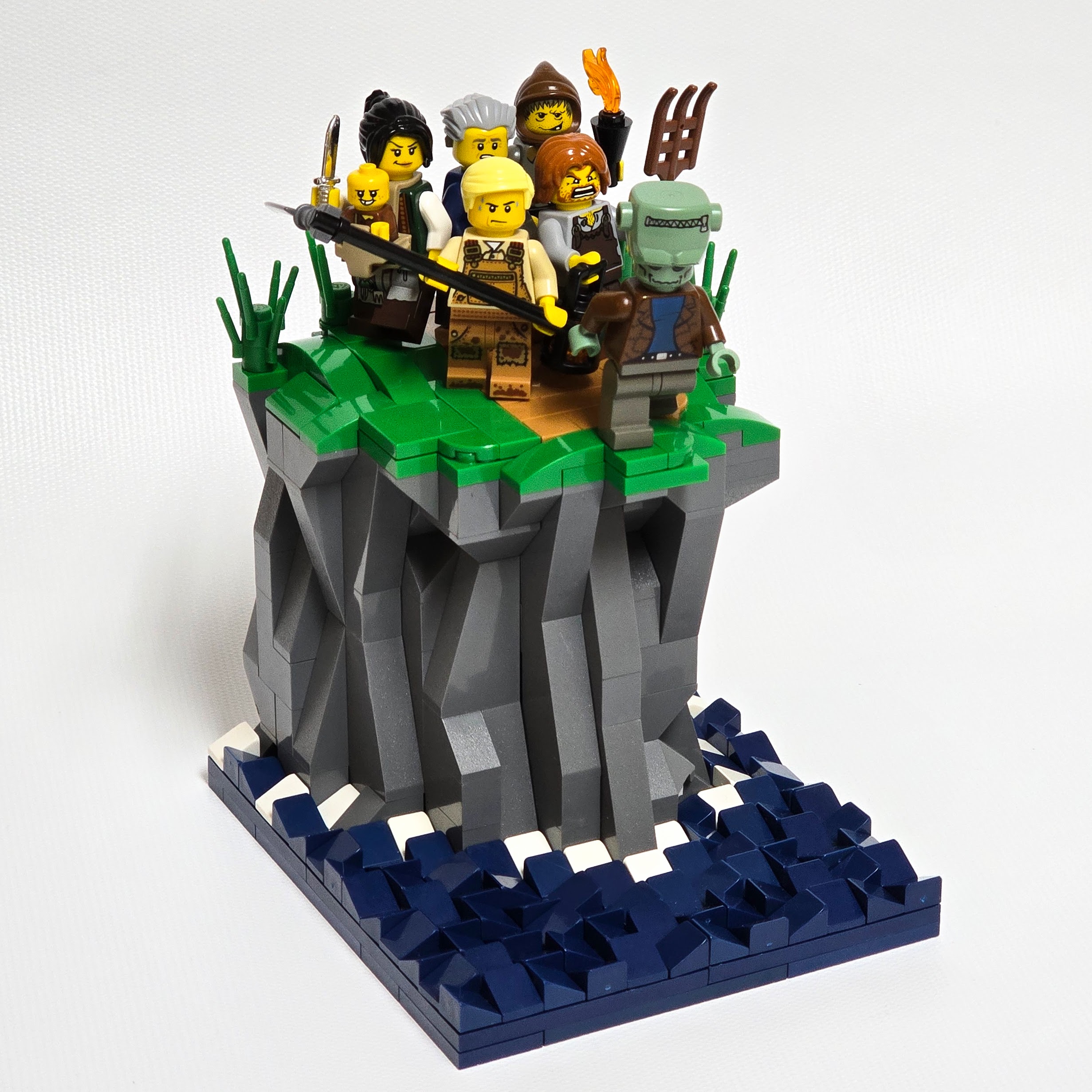 Lego cliff with an angry mob chasing Frankenstein's monster, created by Alex Lyman