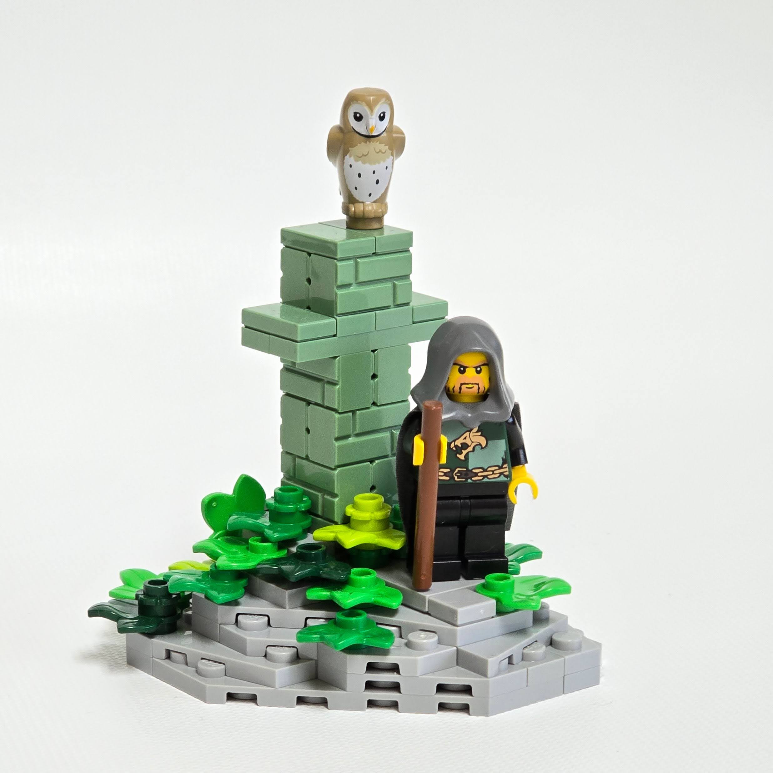 Lego knight by a cross in the woods, created by Alex Lyman